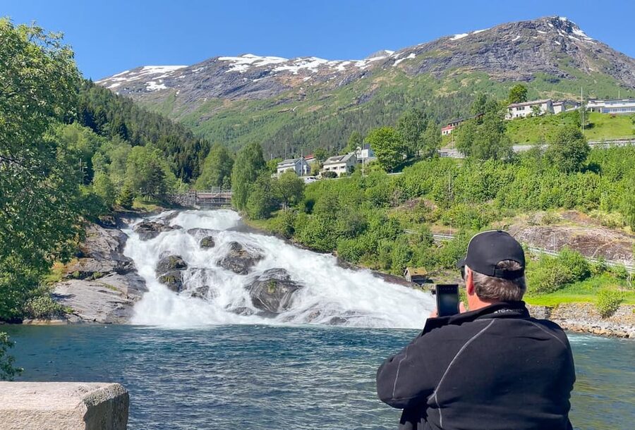 All About the Fjords, in one tour by boat & bus from Ålesund - Øye village stop: quick fjord-heart check
