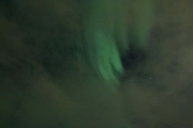 Arctic Ocean Night Floating in Ramfjord - Getting geared up: warmth is the product here
