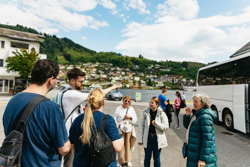 Bergen: Old Town and Waterfalls Guided Tour with Waffles - Stepping back into Bergen: Bryggen on foot after a city-drive reset