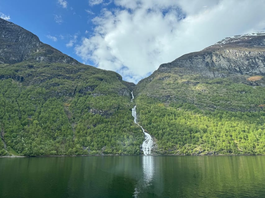 E-bike Tour in Geiranger, Norway - Starting in Geiranger, right by the port, in a green jacket