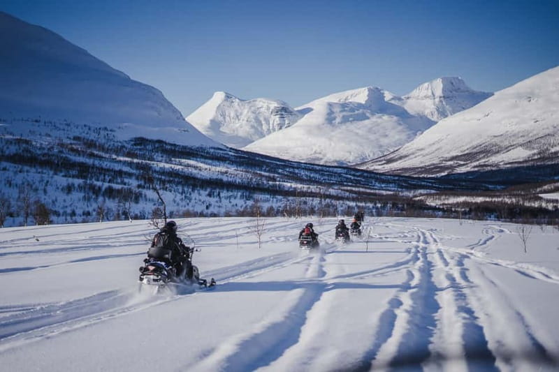 From Tromsø: Snowmobiling at Camp Tamok & Snow Park Visit - Getting geared up: thermal suit, helmet, boots, and the stuff that actually keeps you warm