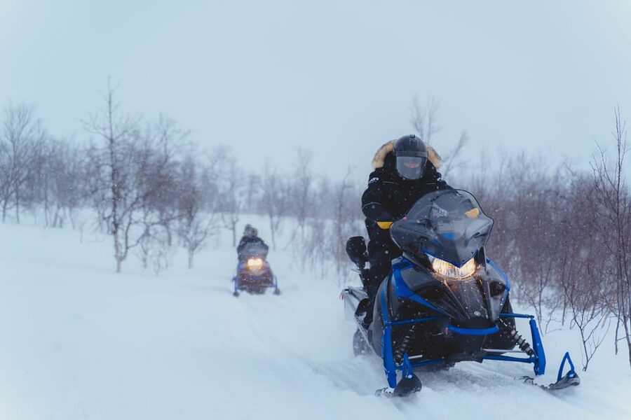 From Tromsø: Snowmobiling Tour at Camp Tamok - Camp Tamok in the lavvu: hot stew, warm drinks, and camp life