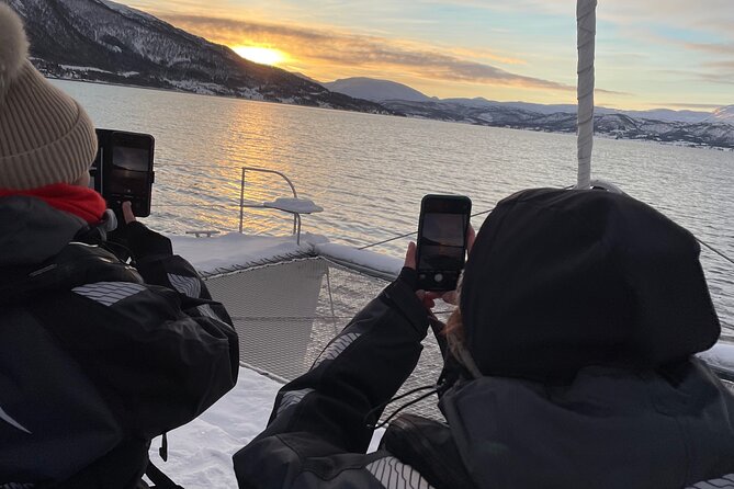 History Fjordcruise Around The Isle Of Tromso - Luxury Catamaran - Circling past Kvaløya: scenery plus captain-led history
