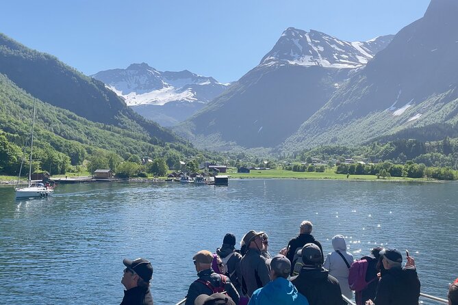 Hjørundfjord Fjord Tour Roundtrip from Ålesund - Øye village stop: a short walk under steep mountains