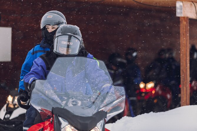 Midday Snowmobiling in Camp Tamok with Guide - The snowmobile ride itself: pairs, alternating control, and Arctic pace