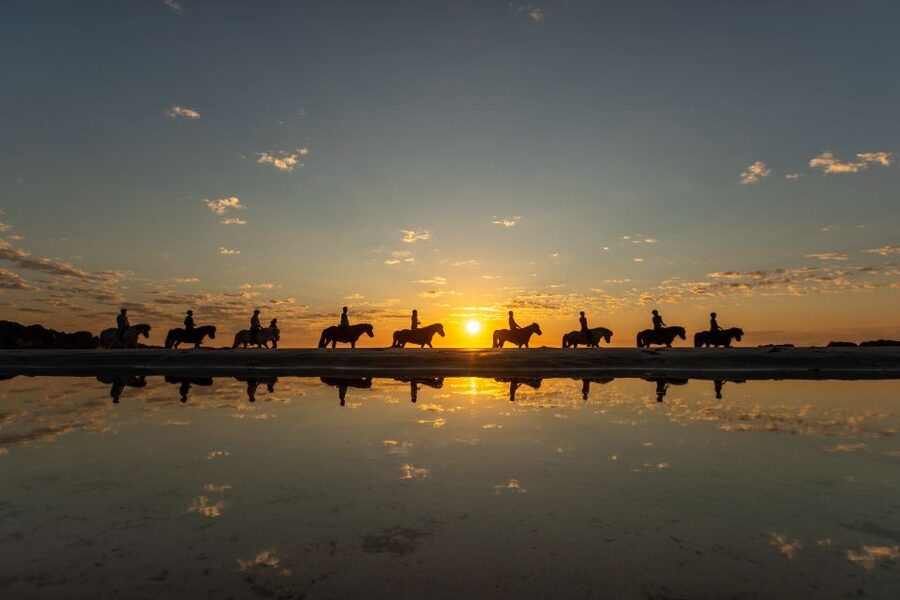 Midnight sun tour - The slow climb out of the stables, ocean on one side and mountains on the other