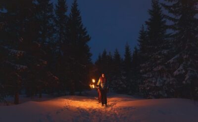 Snowy Forest Torchlight Walk with Campfire