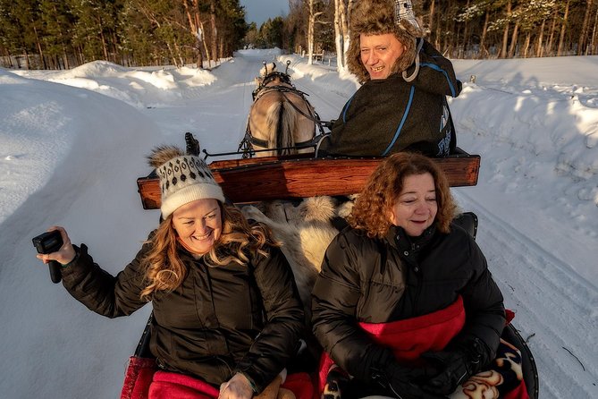 Sleigh or wagon ride in the arctic Country side - Warmth system: suits, reindeer-skin seating, and the wooden fire hut