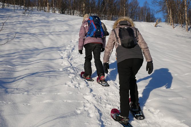 Snowshoeing With A View - The grill cabin payoff: warm meal, drinks, and fire comfort