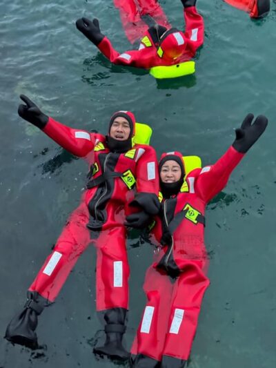 Arctic Fjord Floating in Survival Suit