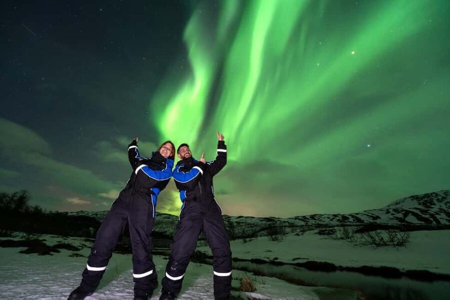 Tromsø: Big Bus Northern Lights Tour with Free Photos - Entering Tromsø by Bus, Then Leaving the City Lights Behind