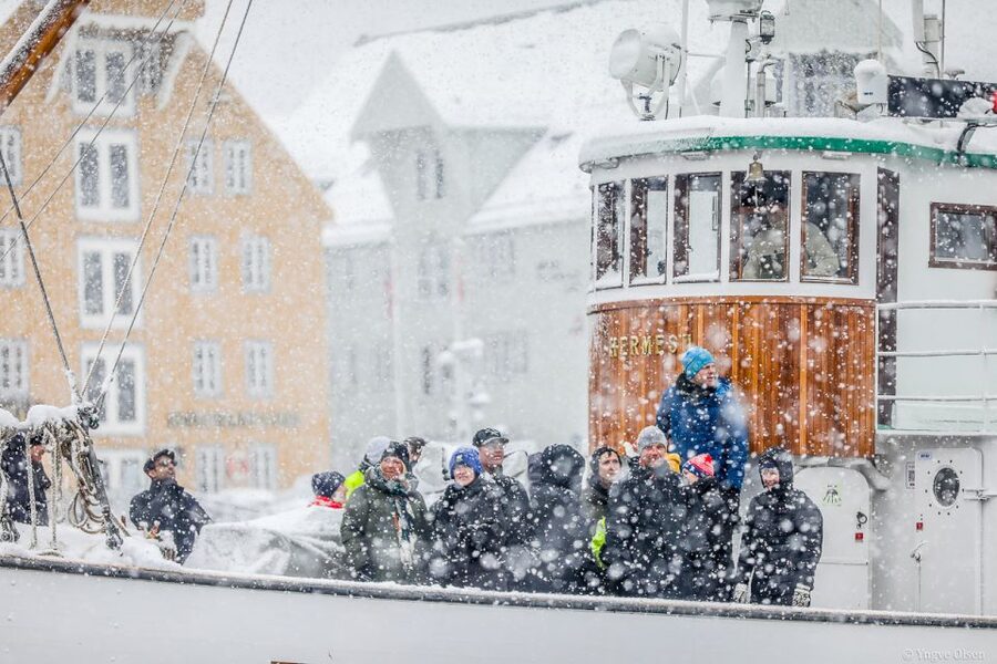 Tromsø: Fjord History Cruise with Snack and Drinks - Food and warmth on board: fish cake, hot drinks, and thermal suits