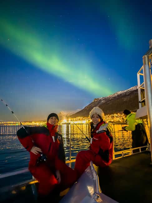 Tromsø: Nocturnal cod fishing with meal. - Storgata 88 Meeting Point: Suit Up Fast, Then Get on the Water